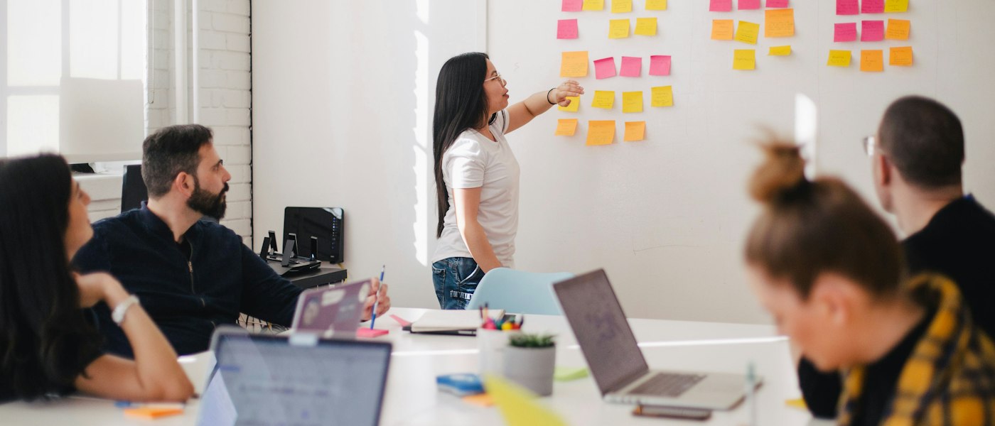 A strategy session working through evidence mapped across a wall of notes